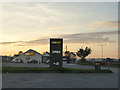 SX2480 : Subway restaurant beside the A30 at Plusha at dusk by Rod Allday