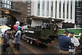 View of a Royal Marines Commando vessel on the back of a low loader in the Lord Mayor