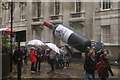 TQ3281 : View of a Worshipful Company of Vintners inflatable wine bottle in the Lord Mayor's Parade from Noble Street by Robert Lamb