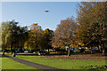 An aeroplane passes over The Moor on its way to Manchester Airport