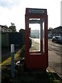 Highworth: a K8 phone box against the sun