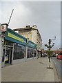 Supermarket with ghost advert above it