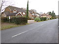 Nuthurst Road with footpath junction before houses