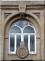 1889 emblem plaque on the pumping station