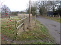 Looking east on Dragons Lane from footpath junction