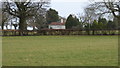 House on Cuckfield Road seen from footpath to the west