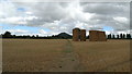 Stacked hay bales & view towards The Wrekin from field path by Ranslett House, Eaton Constantine