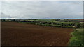 On Jurassic Way - heading down by ploughed field towards Shotley & view towards Welland Viaduct