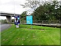 SE2913 : Signs at exit from Woolley Edge Services  by Peter Holmes