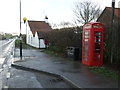 Elizabeth II postbox and telephone box on Main Street, Bainton