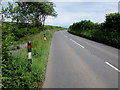 SS1098 : Black, white and red roadside markers near Penally by Jaggery