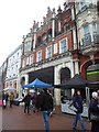 Shoppers passing Lloyds Avenue