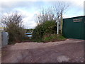 Unsurfaced lane heading north, at the entrance to Woody Bottoms Welsh Ponies