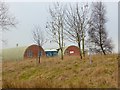 NY9917 : Nissen huts at Battle Hill Range by Oliver Dixon