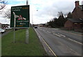 Directions sign facing eastbound traffic on Llanidloes Road, Newtown