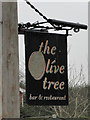 Hanging sign for The Olive Tree public house