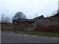 Ramshackle outbuildings beside the road