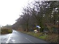 A seat and signpost at Ausewell Cross