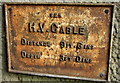 Underground cable marker on a Frome railway bridge