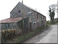 Tin roofed shed and a disused coach house on the Drumnahunshin Road