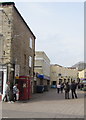 Grade II listed red phoneboxes on a town centre corner, Frome