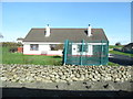 Bungalow on the north side of the A25 at Barnmeen