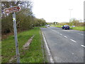 Looking north on the A24 across the junction with the B2126