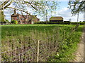 Dwelling and barn at Eversheds Farm seen from bridleway