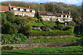 View across valley to cottages on Teapot Hill