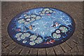 Artwork in paved area outside the Tower Centre, Alvescot Road, Carterton, Oxon