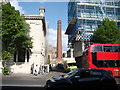 View of a factory chimney between the Peg + Patriot Typing Room and a block of flats on Cambridge Heath Road