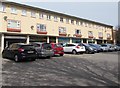 Row of shops and row of parked cars, Gaer Road, Newport