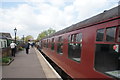 View of a diesel train at the platform at Ongar station