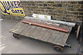 View of a small wooden tray on the platform at Ongar