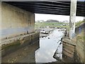NZ3376 : Looking upstream under the road bridge at Seaton Sluice by Oliver Dixon