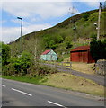 Corrugated metal buildings above the A4046, Cwm