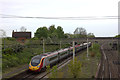 Remains of Castlethorpe station with northbound Pendolino