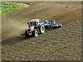 NH8953 : Ploughing, Park Farm by David Dixon