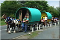 Traditional horse-drawn Gypsy caravans on the A684, Wensley