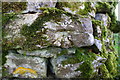 Benchmark on stone in dry stone wall near Cowside Farm