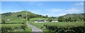 Valley floor farmhouses and outbuildings in the shadow of Seeconnell