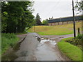 Road junction and entrance to Fortnightly Farm