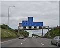 TL0902 : Sign gantry and footbridge over M25, 1 mile before junction 21 by David Smith