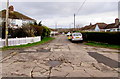 Cracked road surface at the southern end of Ynyslas, Porthcawl