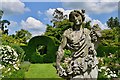 Helmingham Hall: Rose garlanded sculpture in the Rose Garden