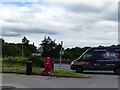 Van entering New Road from the A38