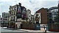 View of murals on the side walls of the Hat & Feathers Restaurant and 12-16 Clerkenwell Road from Goswell Road