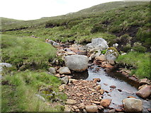 NN4898 : Boulders in the streambed of Allt Feith a' Mhoraire high above upper Speyside by ian shiell