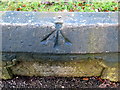 Rivet bench mark on the Calderstones surround