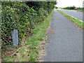 Milestone beside the A497 road